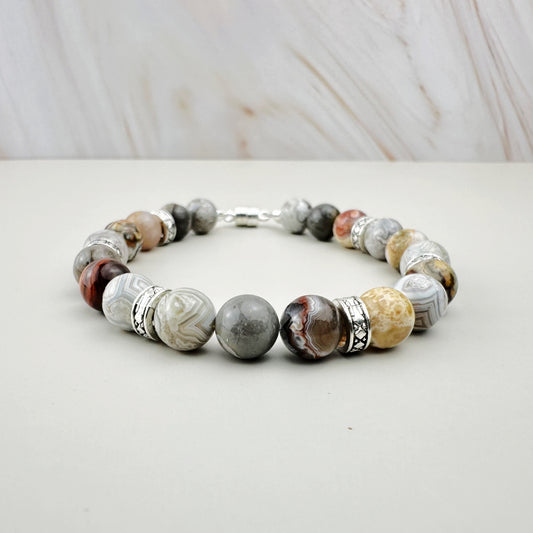 Bracelet with marbled beads on a white surface