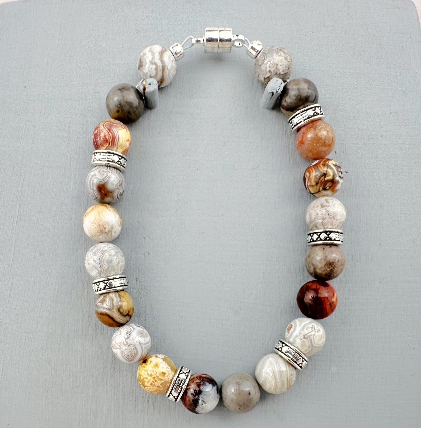 Bracelet with multicolored beads on a gray background