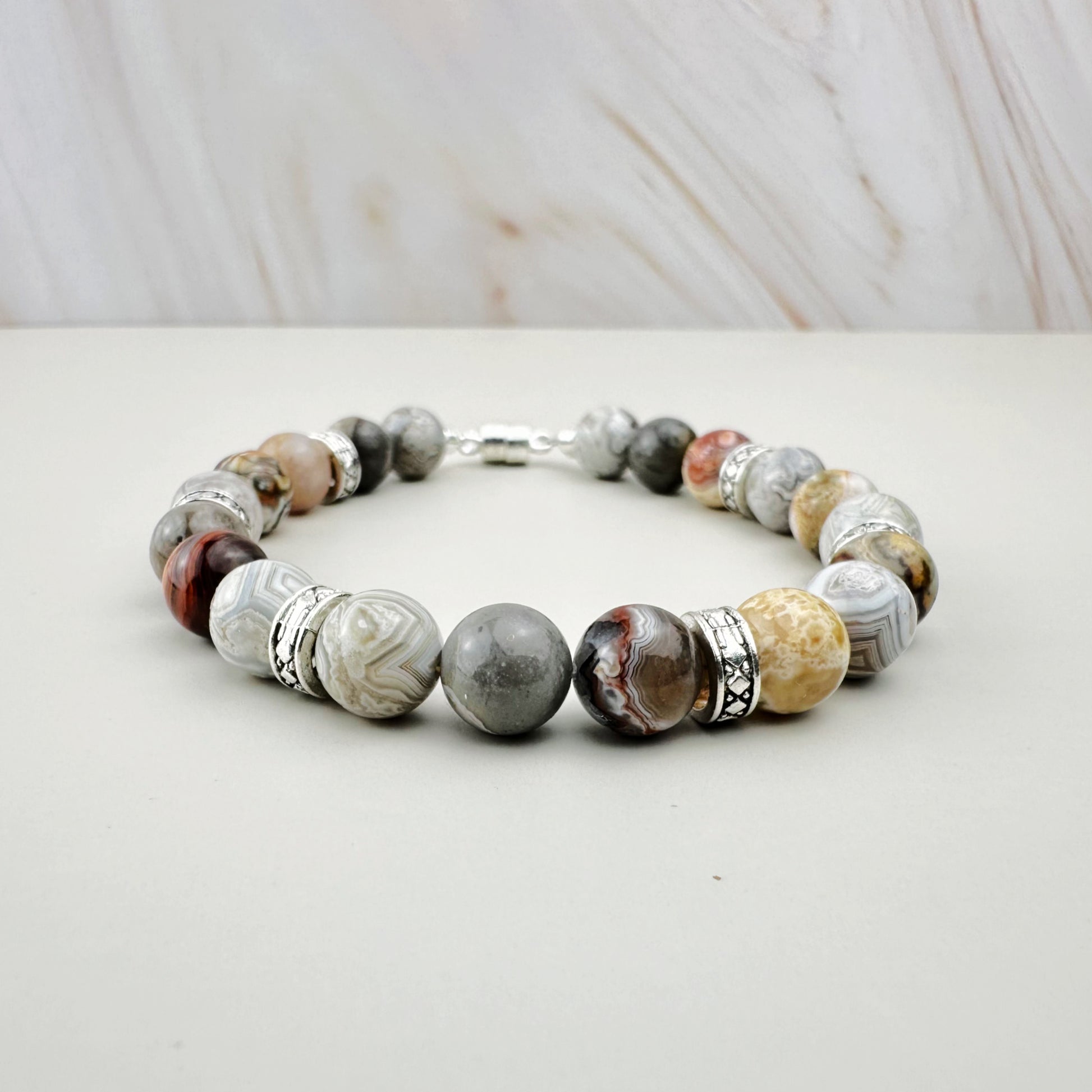 Bracelet with marbled beads on a white surface