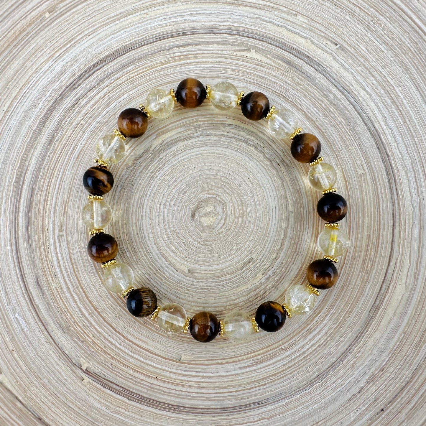 Bracelet with tiger eye and clear beads on a textured surface
